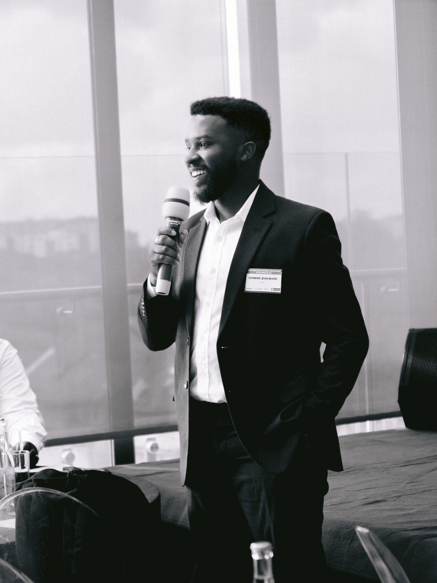 Ishimwe Jean Marie speaking at a conference